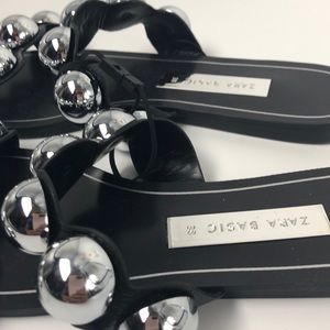 black slides with silver balls